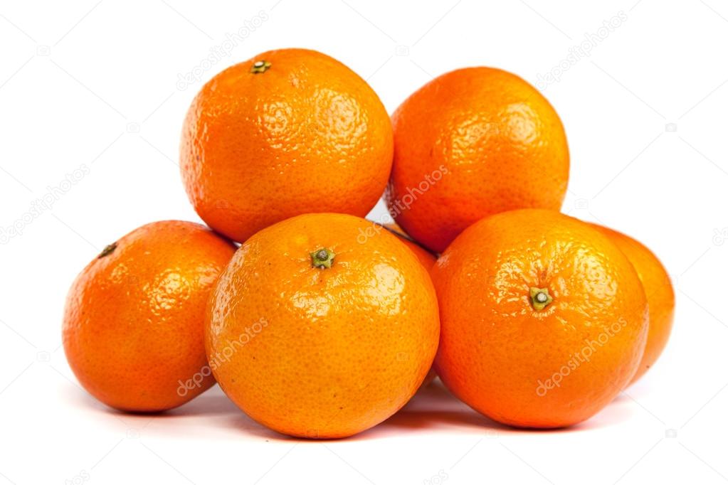 Group of ripe tangerine or mandarin with slices on white