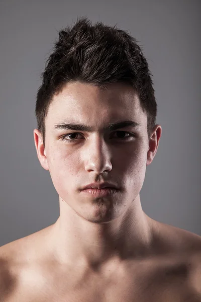 Handsome face of a young man on grey — Stock Photo, Image