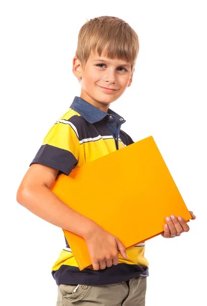 Menino da escola está segurando um livro — Fotografia de Stock