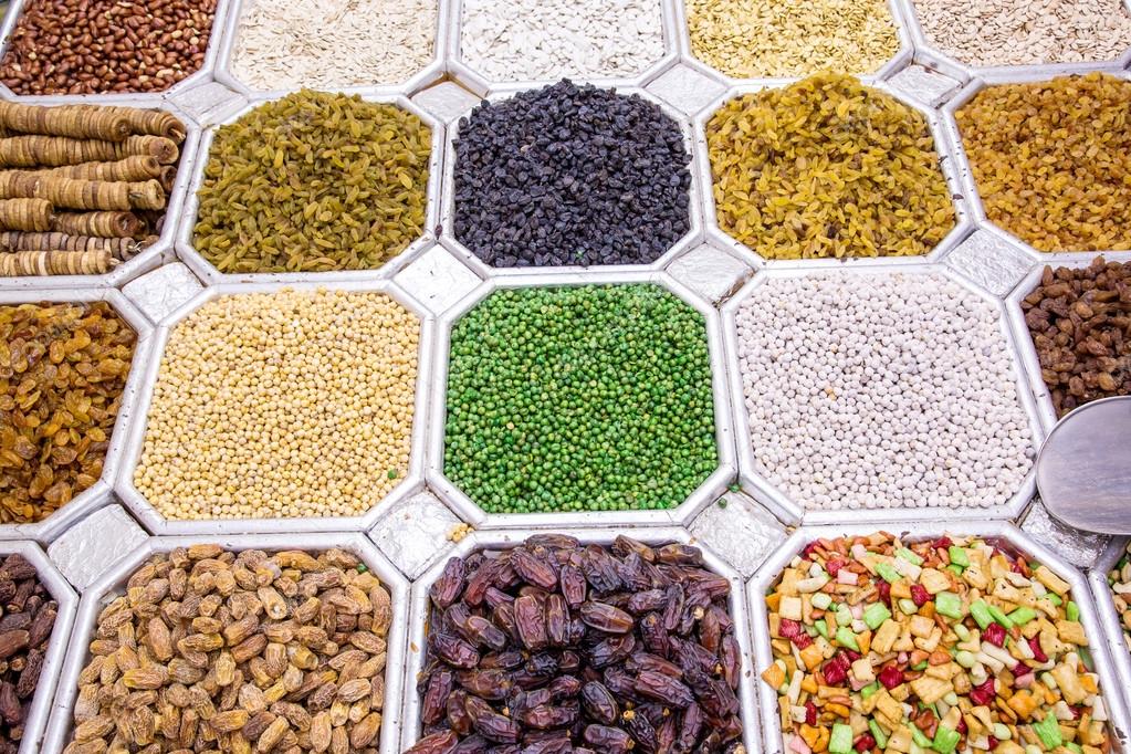 Dried fruit and nuts mix in Dubai market — Stock Photo © bloodua 23267300