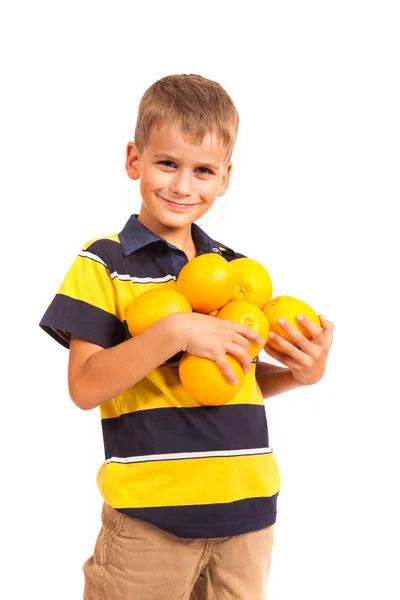 Chłopca gospodarstwa pomarańcze — Zdjęcie stockowe