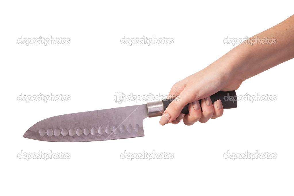 Hand is holding a kitchen kinfe isolated