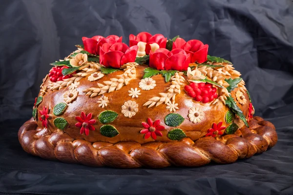 Ukrainian festive bakery Holiday Bread on black — Stock Photo, Image