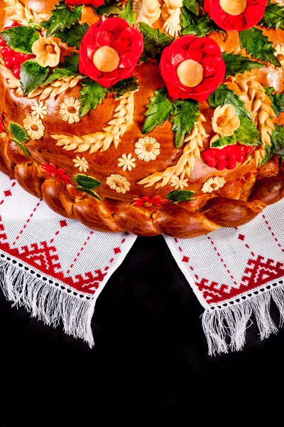 Ukrainian festive bakery Holiday Bread on black — Stock Photo, Image