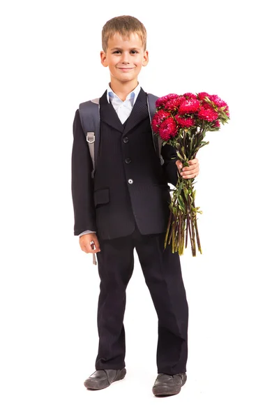 Schoolboy is holding flowers. Back to school — Stock Photo, Image