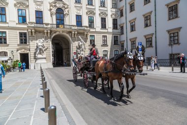 Traditional coach (Fiaker) today traveling tourists in Vienna, A clipart
