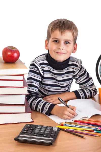 Cute schoolboy is writting — Stock Photo, Image