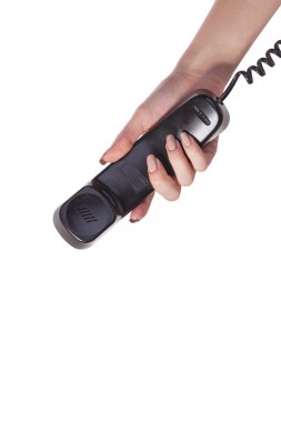 eski bir siyah telefon tüpü tutan el