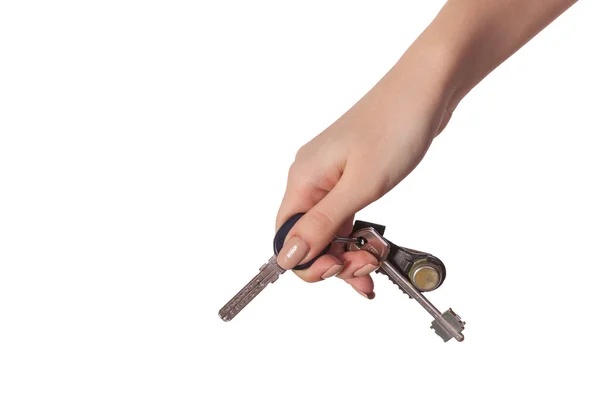 Main féminine tenant une clé de la maison — Photo