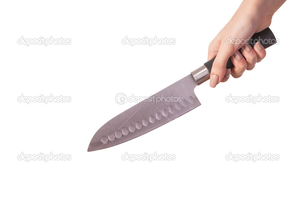 Hand is holding a kitchen kinfe isolated