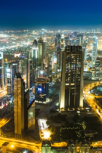 Dubai downtown night scene with city lights, — Stock Photo, Image