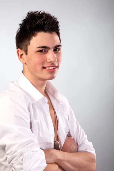 Young man on grey background — Stock Photo, Image