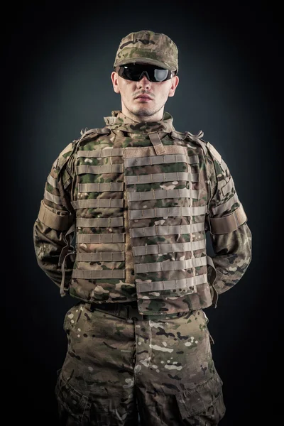 Military man on a black background — Stock Photo, Image