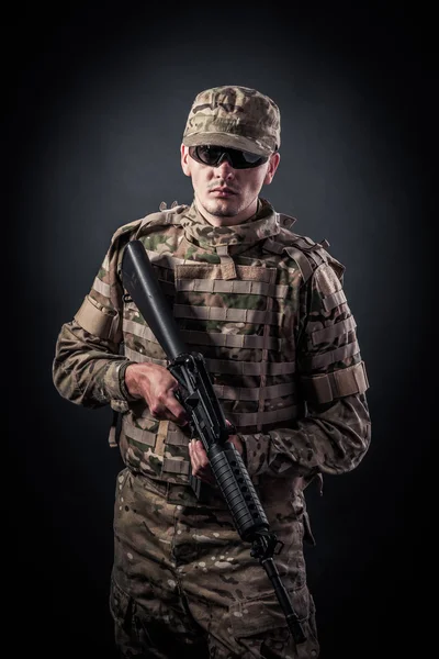 Modern soldier with rifle — Stock Photo, Image