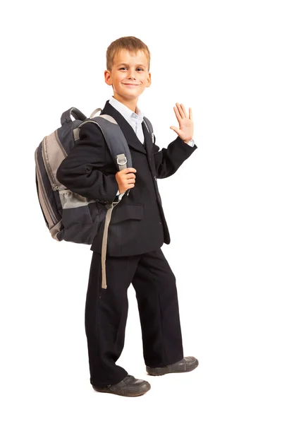 Schoolboy sitting on books — Stock Photo, Image