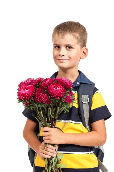 Schoolboy tient des fleurs — Photo
