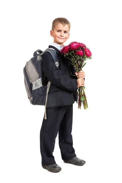 O estudante está a segurar flores. De volta à escola — Fotografia de Stock