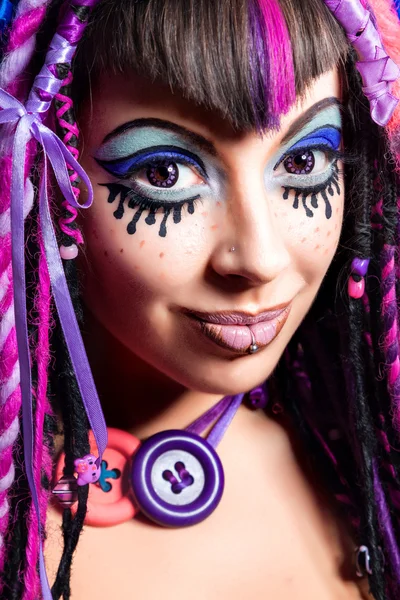 Portrait of a woman with multicolored dreadlocks and stylish mak — Stock Photo, Image