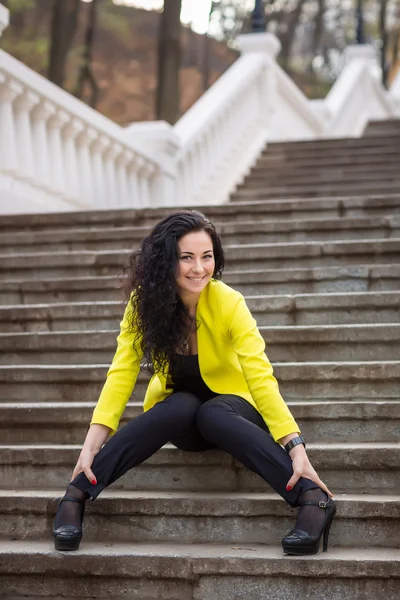 Beautiful Woman in warm autumn day on staircase — Stock Photo, Image