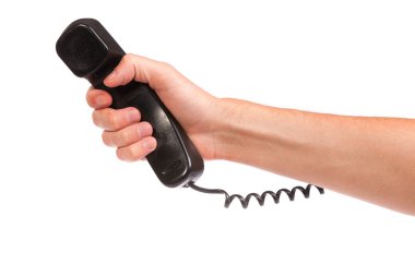 eski bir siyah telefon tüpü tutan el