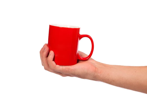 La mano masculina sostiene una taza roja —  Fotos de Stock