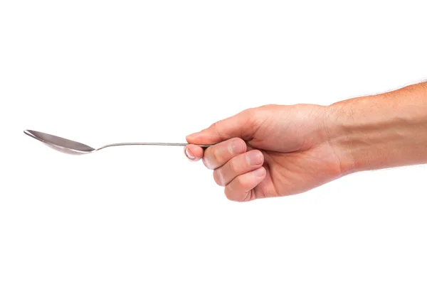 La mano sostiene una cuchara aislada — Foto de Stock