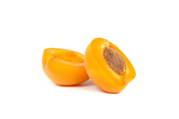 Two ripe apricot sectioned by knife — Stock Photo, Image