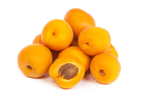 Group of ripe apricots with a half — Stock Photo, Image