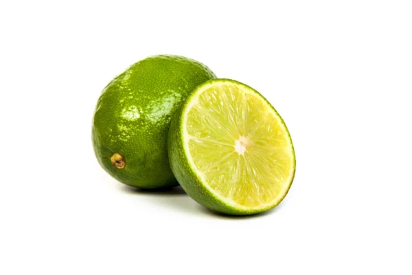 One whole lime and one half lime — Stock Photo, Image