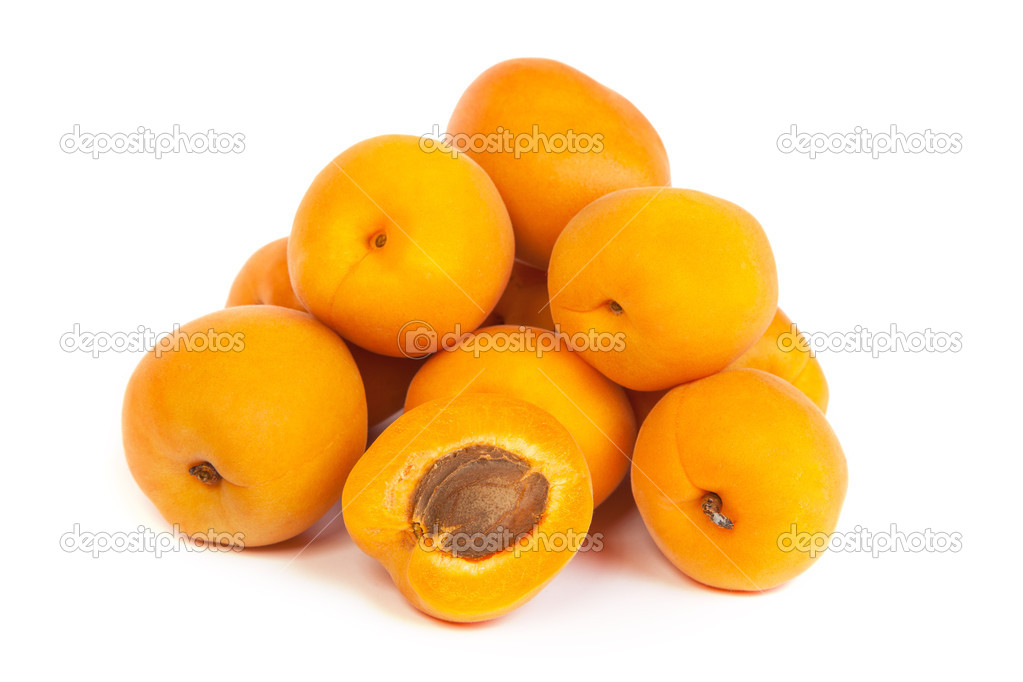 Group of ripe apricots with a half