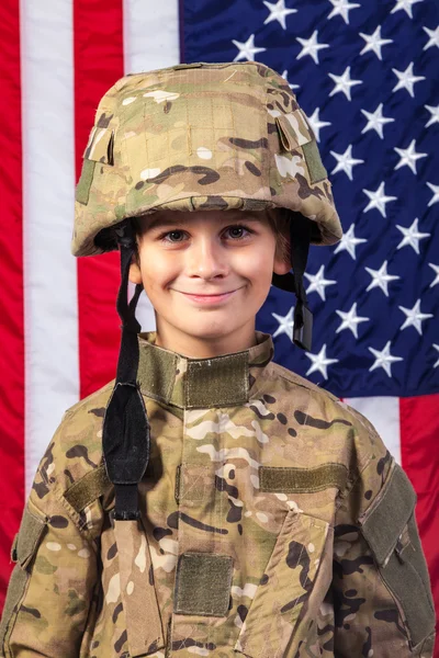 Young boy dressed like a soldier with American flag — Stock Photo, Image