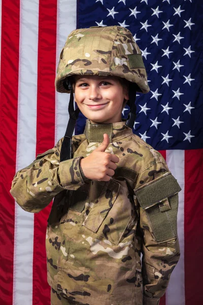 Young boy dressed like a soldier with American flag — Stock Photo, Image