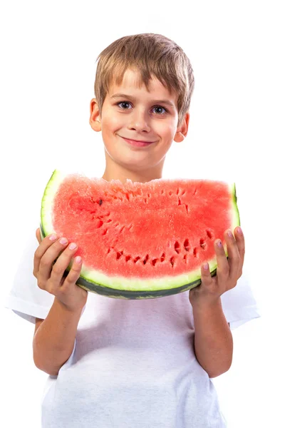 Pojke äter en vattenmelon — Stockfoto