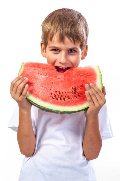 Boy is eating a watermelon — Stock Photo, Image