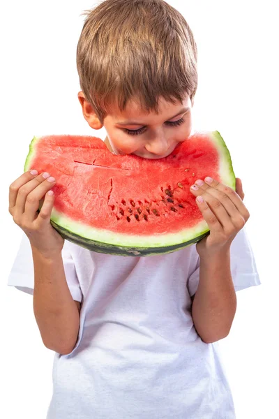 Boy is het eten van een watermeloen — Stockfoto