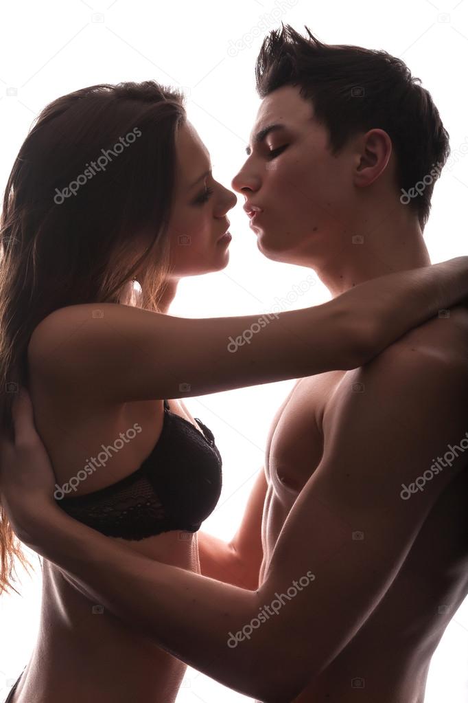 Portrait of happy young couple hugging