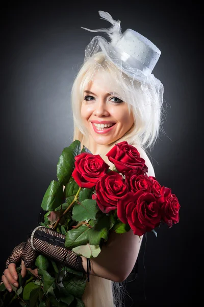 Sexy woman in retro style with red roses — Stock Photo, Image