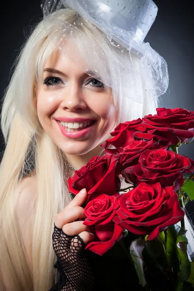 Sexy woman in retro style with red roses — Stock Photo, Image