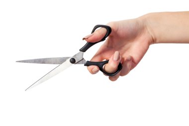 Hand is holding scissors clipart