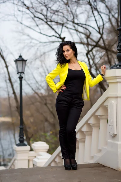 Beautiful Woman in warm autumn day on staircase — Stock Photo, Image