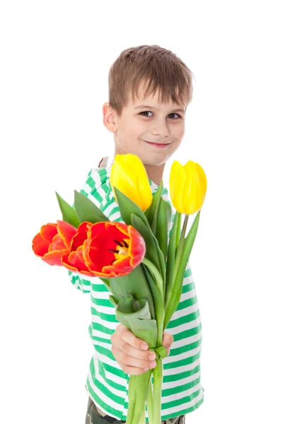 Niño sosteniendo tulipanes — Foto de Stock