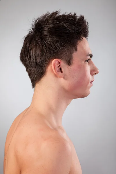 Handsome face of a young man on grey — Stock Photo, Image