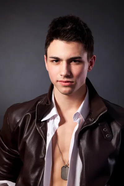 Healthy muscular young man on grey background — Stock Photo, Image