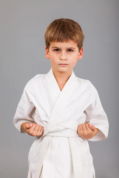 Karate boy in white kimono fighting — Stock Photo, Image