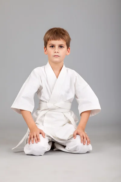 Karate boy in white kimono fighting — Stock Photo, Image