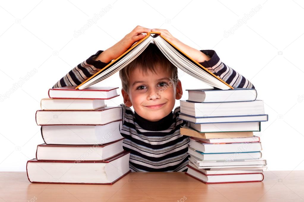 Schoolboy and a heap of books