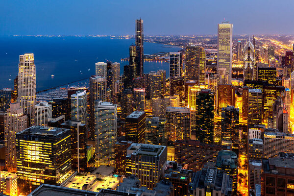 Panoramic aerial cityscape of Chicago and Lake Michigan at night, Illinois, USA