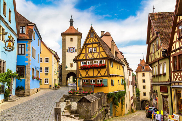 ROTHENBURG, GERMANY - JUNE 18, 2016: Medieval old street in Rothenburg ob der Tauber in a beautiful summer day, Germany on