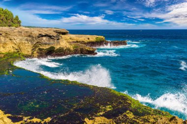 Smaller Devil's Tear at Nusa Lembongan island in a sunny day, Bali, Indonesia