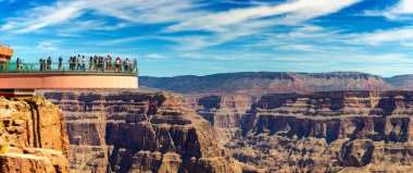 ARIZONA, USA - MARCH 29, 2020: Panorama of  Tourist enjoying the view at Grand Canyon Skywalk observation point at Grand Canyon West Rim, Arizona, USA clipart